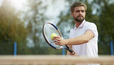 Man with tennis racquet